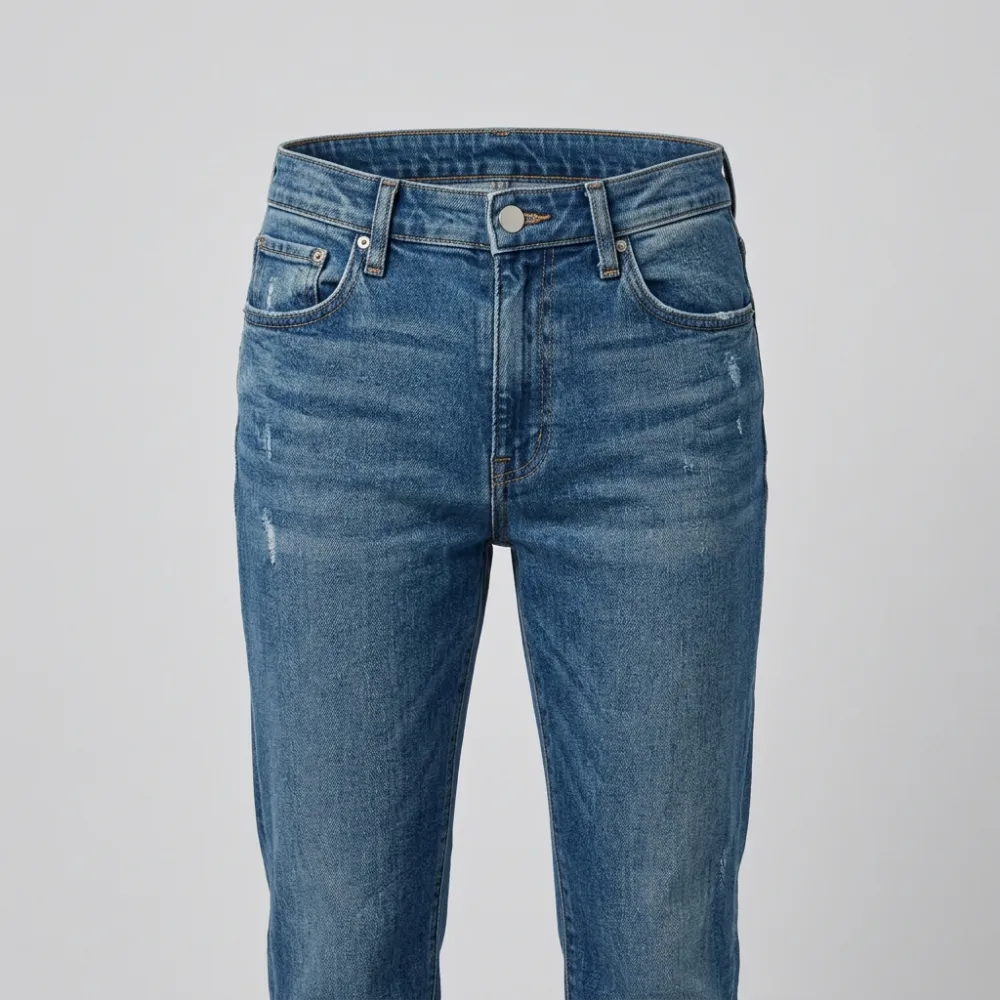 The same jeans after the waist was taken in, with the waistband sitting flat.